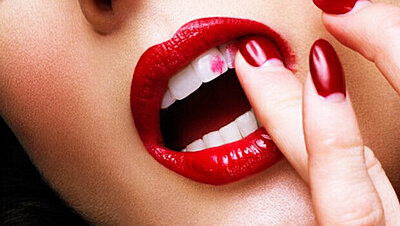 Seven Tricks to Keep Lipstick off Your Teeth