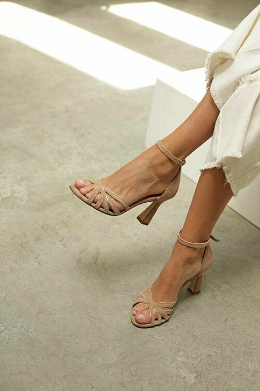 beige sandal, perfect for adding a touch of elegance to any outfit.