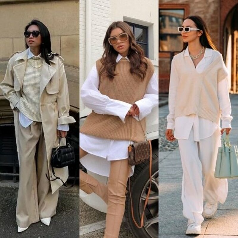 Three women in beige outfits and sunglasses posing together.