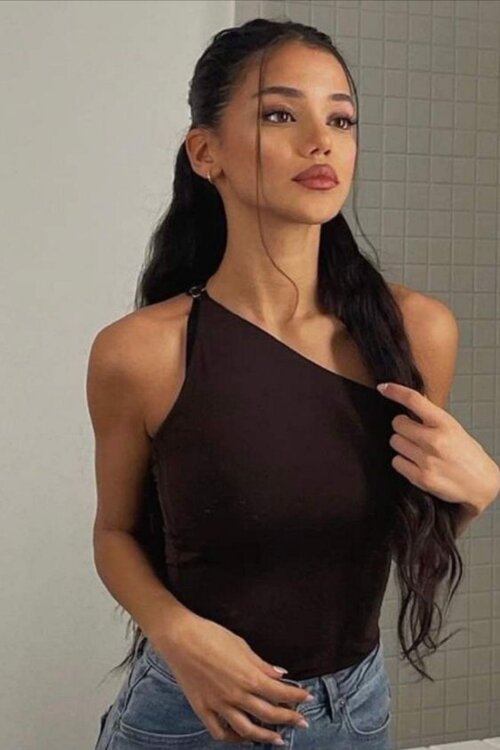 One-Shoulder Top with Half-Up Hairstyle